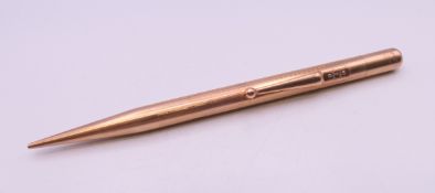 A 9 ct gold cased Fyne Poynt propelling pencil inscribed JAC. 12.5 cm long. 21.