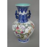 A Chinese porcelain vase decorated with boys and peaches. 36.5 cm high.