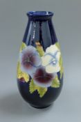 A Moorcroft style vase. 30 cm high.