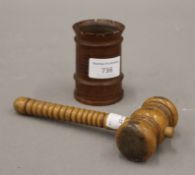 A 19th century treen dice shaker and a gavel. The former 8 cm high.
