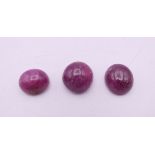 Three loose rubies. Each approximately 1 cm long.