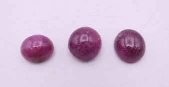Three loose rubies. Each approximately 1 cm long.