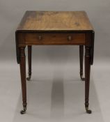 A Victorian mahogany Pembroke table. 84 cm long.