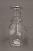 A small early 19th century three ring decanter. 14.5 cm high.