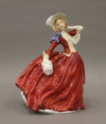 A Royal Doulton figure, Autumn Breeze. 19.5 cm high.