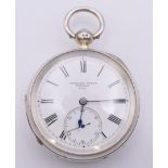 A Charles Young silver open face pocket watch, hallmarked for 1893. 5 cm diameter.