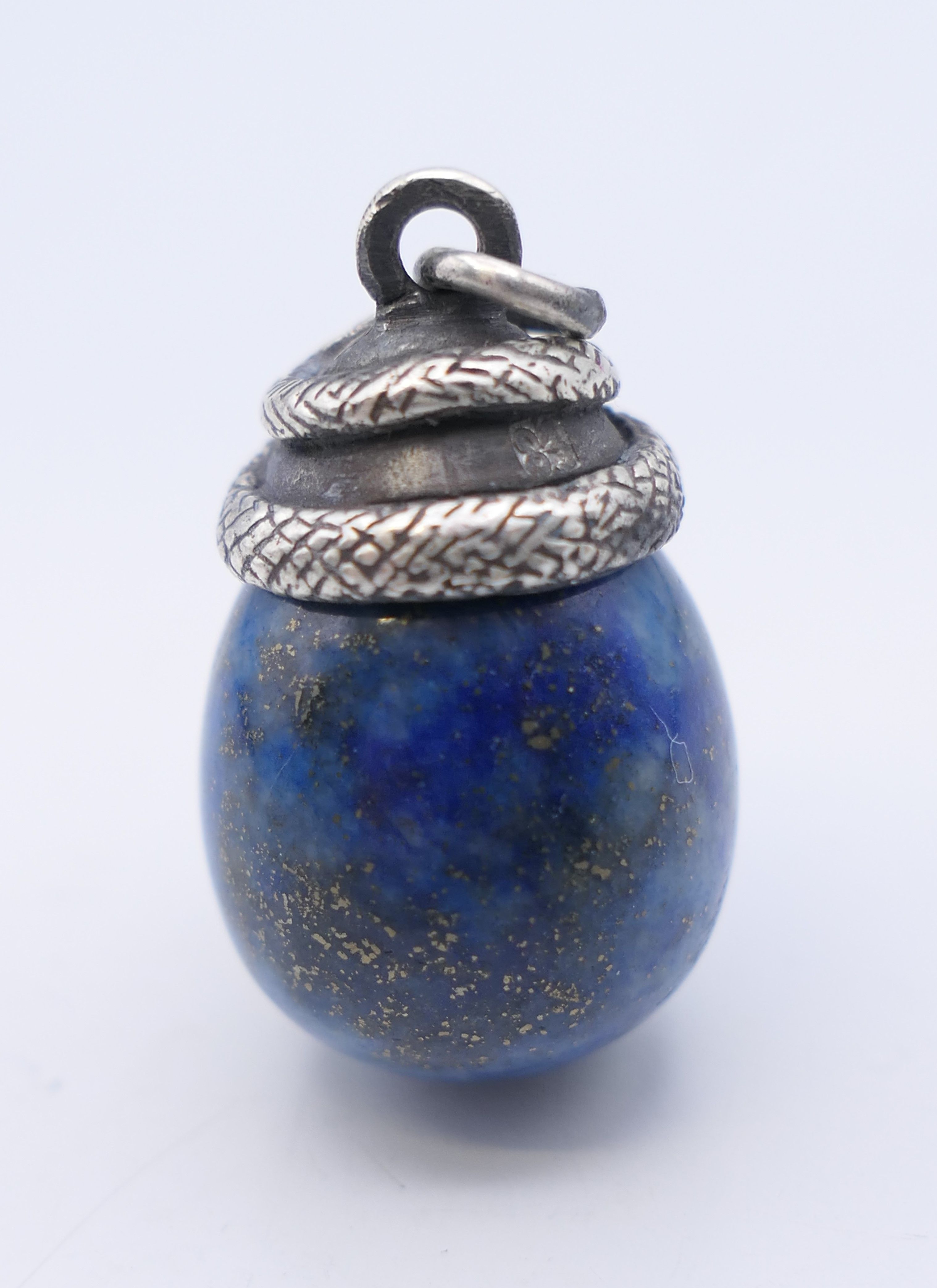A lapis egg form pendant surmounted with a snake, bearing Russian marks. 2.5 cm high. - Image 2 of 4