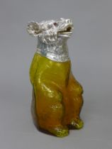 A silver plate mounted amber glass bear form claret jug. 22 cm high.