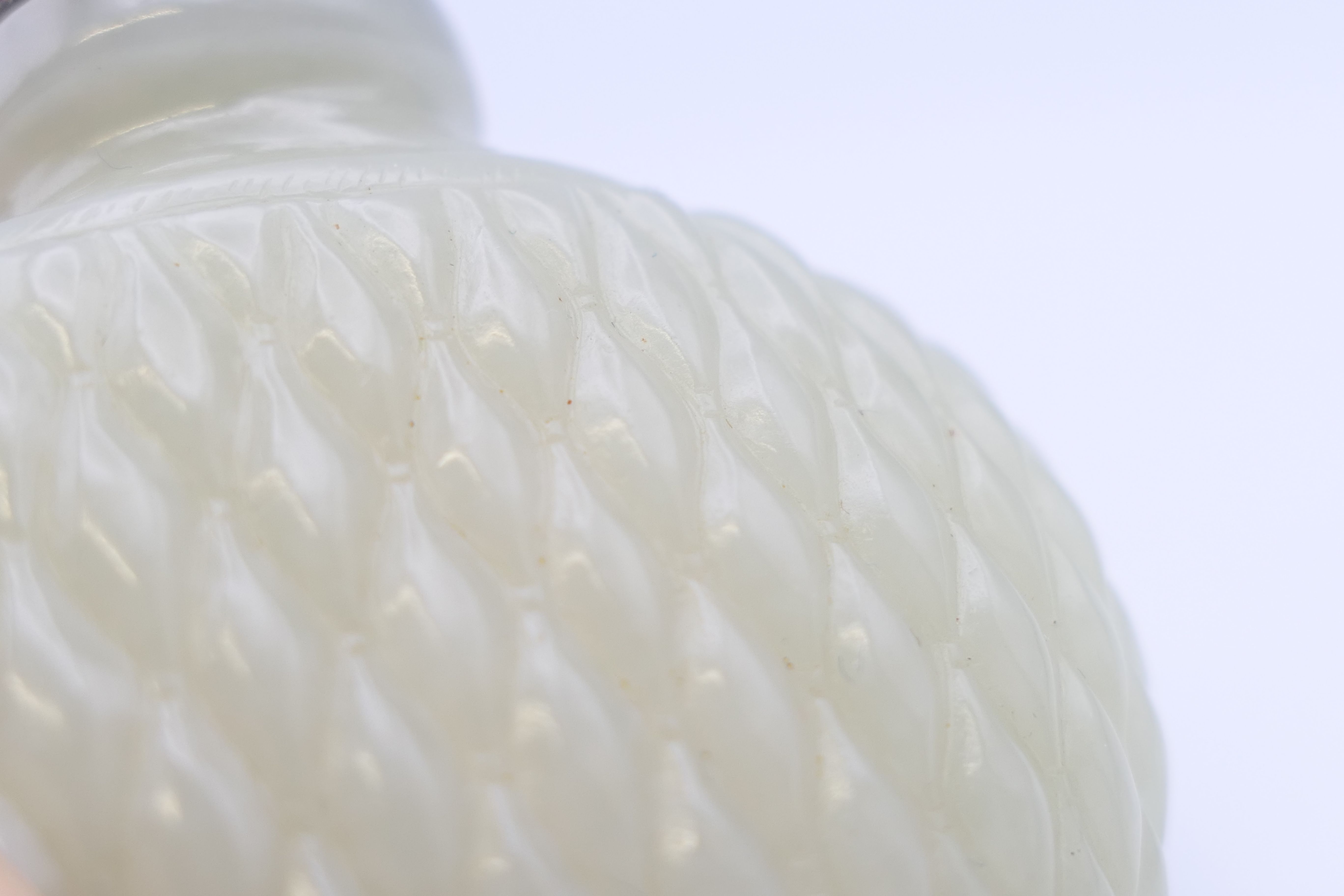A Chinese white jade diamond cut pattern snuff bottle, with red stopper, Qing Dynasty. - Image 7 of 7