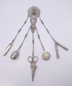 A silver chatelaine. 33.5 cm long. 177 grammes total weight.