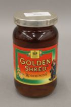 A jar of Golden Shred Marmalade with silver lid. 12.5 cm high.