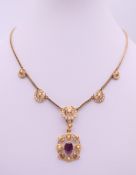 A cased Victorian unmarked gold seed pearl set pendant necklace. 36 cm long. 8.