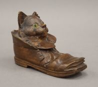 A Blackforest carved wooden cat in boot ink well. 13 cm long.