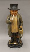 A 19th century painted terracotta figure of a country gentleman,