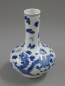 A small Chinese blue and white dragon vase. 21 cm high.