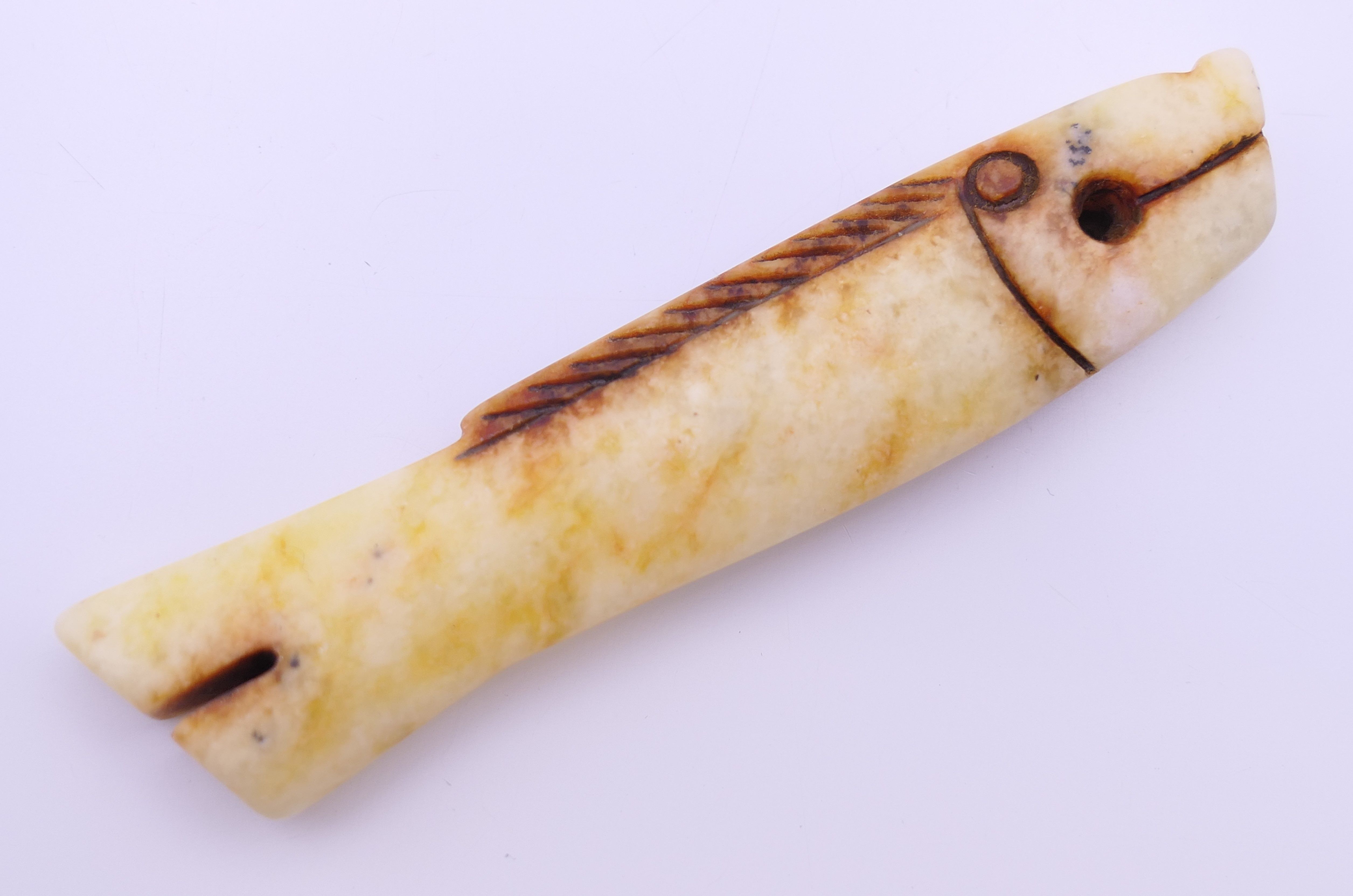 A small Chinese russet jade coloured fish, Shang Dynasty. 7.5 cm long. - Image 2 of 4