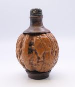 A Chinese walnut snuff bottle. 5.5 cm high. Provenance: The Larkin/Minney Collection.