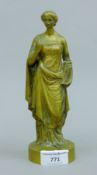 A 19th century bronze model of a classical maiden. 19.5 cm high.