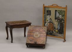 A tapestry inset fire screen, a coal box and a stool. The former 80.5 cm high.