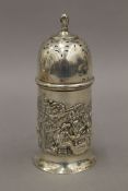 An embossed silver sugar sifter. 13.5 cm high. 87.1 grammes.