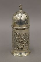 An embossed silver sugar sifter. 13.5 cm high. 87.1 grammes.