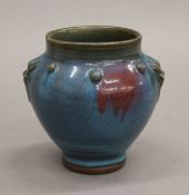 A Chinese blue glazed pottery vase. 11.5 cm high.