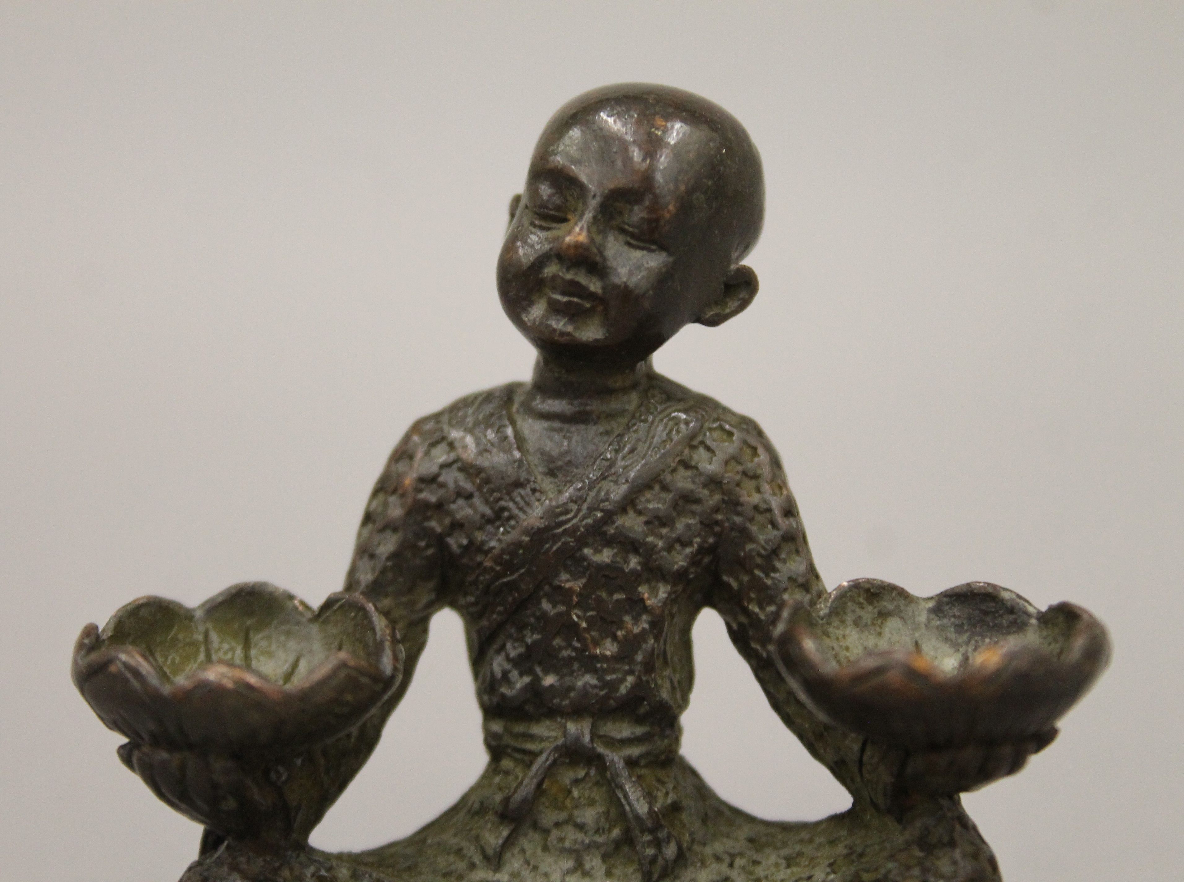 A bronze model of a boy with lilies. 5.5 cm high. - Image 2 of 6