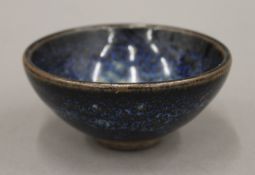 A Chinese blue glazed bowl, Song Dynasty. 9 cm diameter. Provenance: The Larkin/Minney Collection.