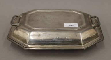 A silver entree dish bearing presentation inscription. 27 cm wide. 1143.9 grammes.