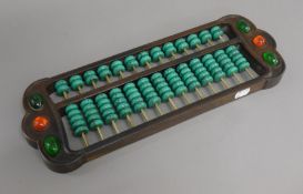 A abacus with turquoise beads. 41 cm long.
