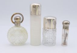 Two silver topped glass scent bottles and two silver plated topped scent bottles.