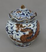 A Chinese porcelain lidded vase decorated with a dragon and calligraphy. 30 cm high.