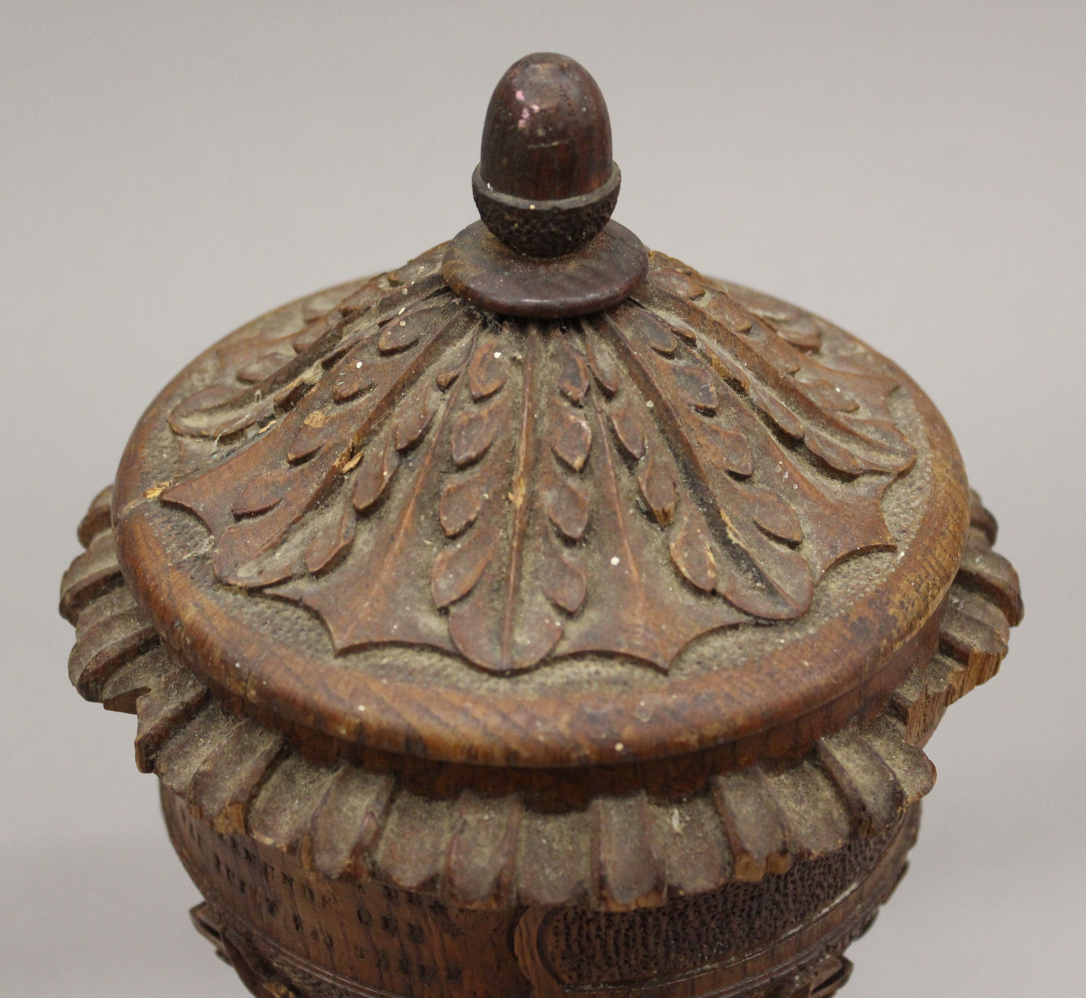 A carved oak cup and cover. 24 cm high. - Image 7 of 7