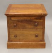 A Victorian walnut commode and a vintage travelling case. The former 46 cm wide.
