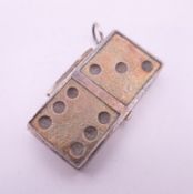 A silver box formed as a domino. 4.5 cm long. 15.3 grammes.