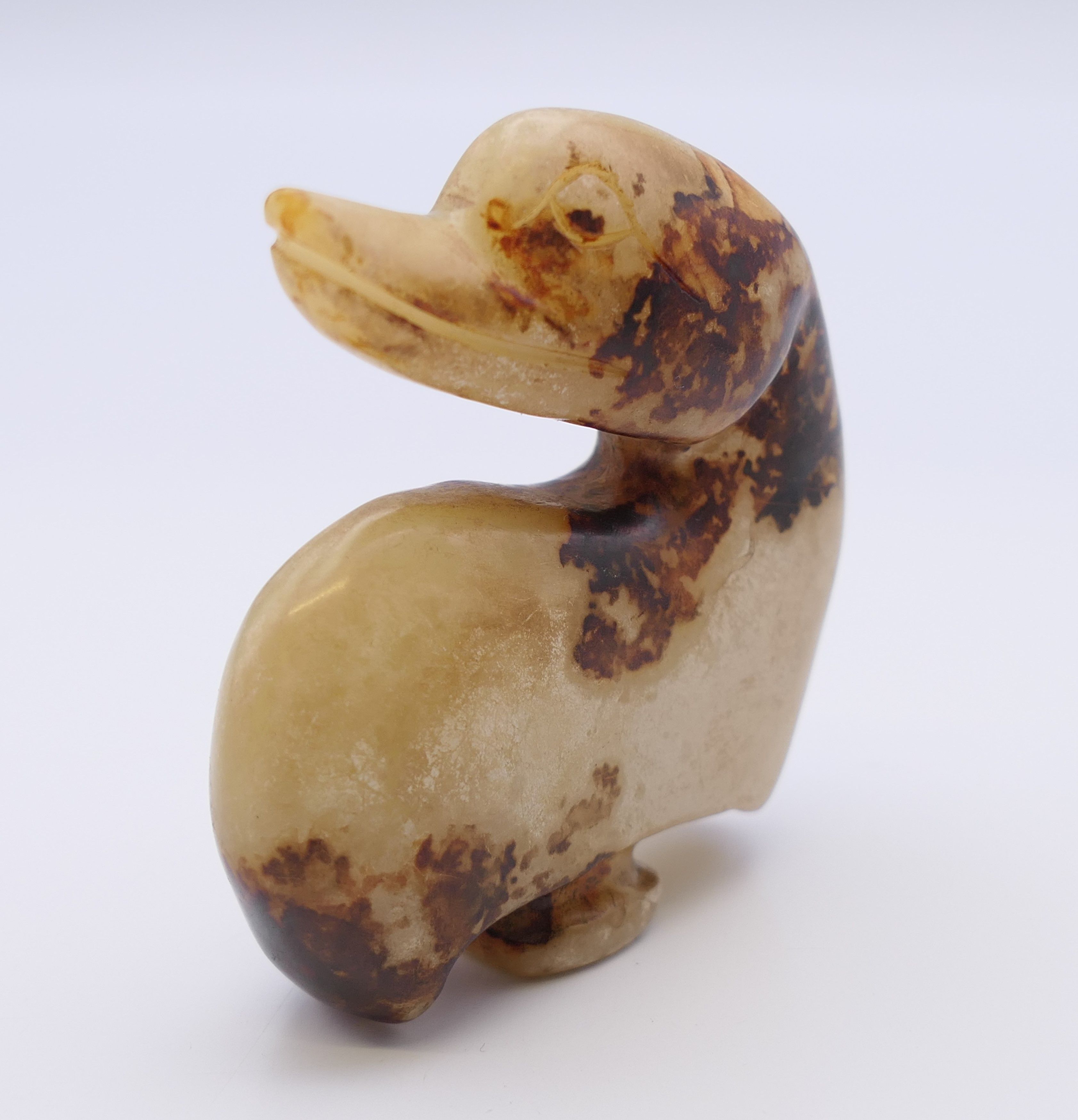 A Chinese off white and brown jade duck belt hook, Ming Dynasty. 5.5 cm high. - Image 6 of 7