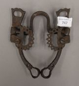 An antique hand forged horse bit. 23 cm wide.