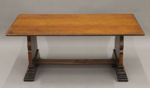 An early 20th century oak coffee table. 109 cm long.