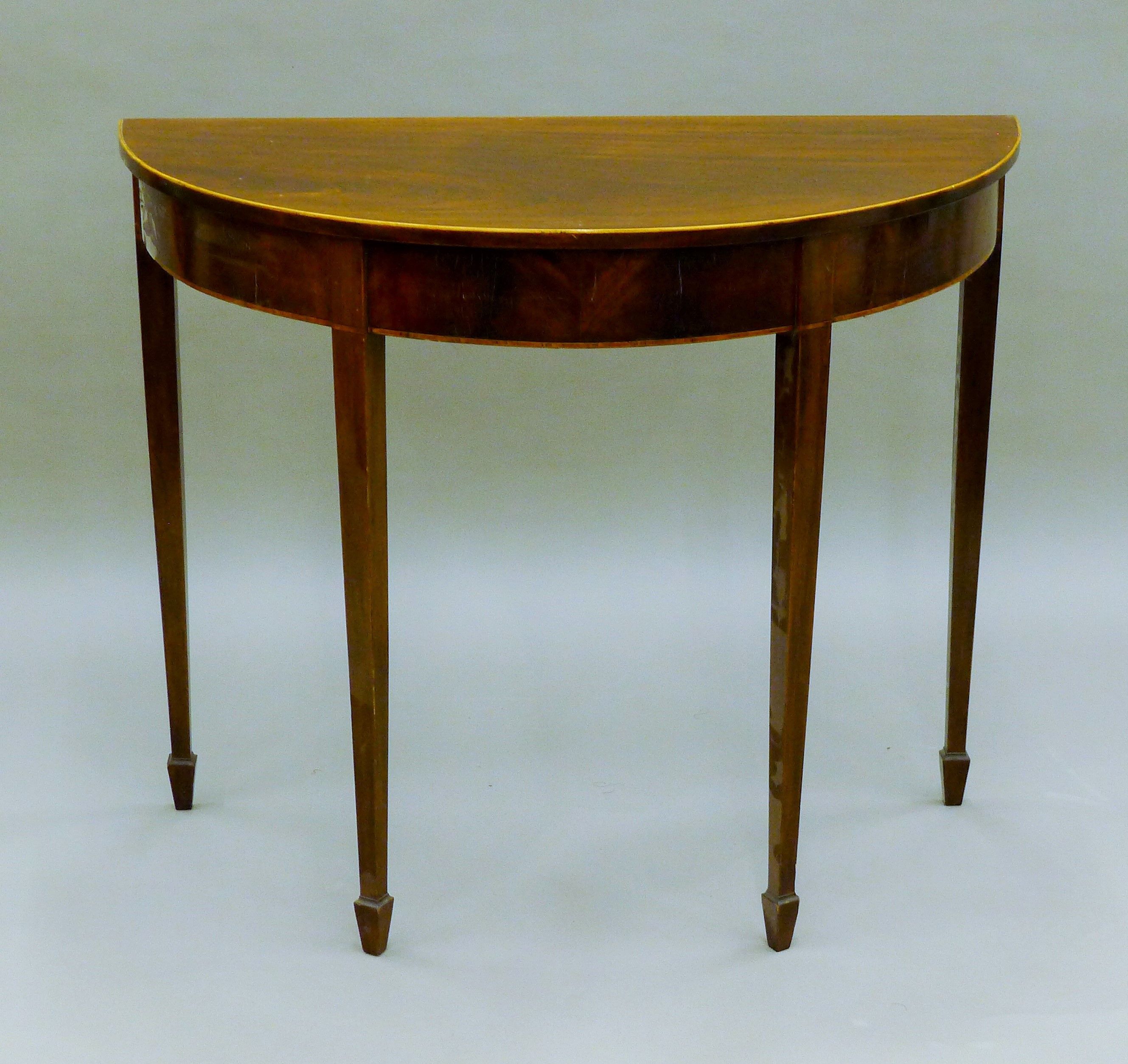 A 19th century mahogany demi lune side table. 91.5 cm wide.