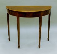 A 19th century mahogany demi lune side table. 91.5 cm wide.