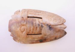 A Chinese russet jade coloured cicada, Shang Dynasty. 6 cm long.