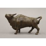 A bronze model of a bull. 7.5 cm long.