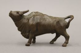 A bronze model of a bull. 7.5 cm long.