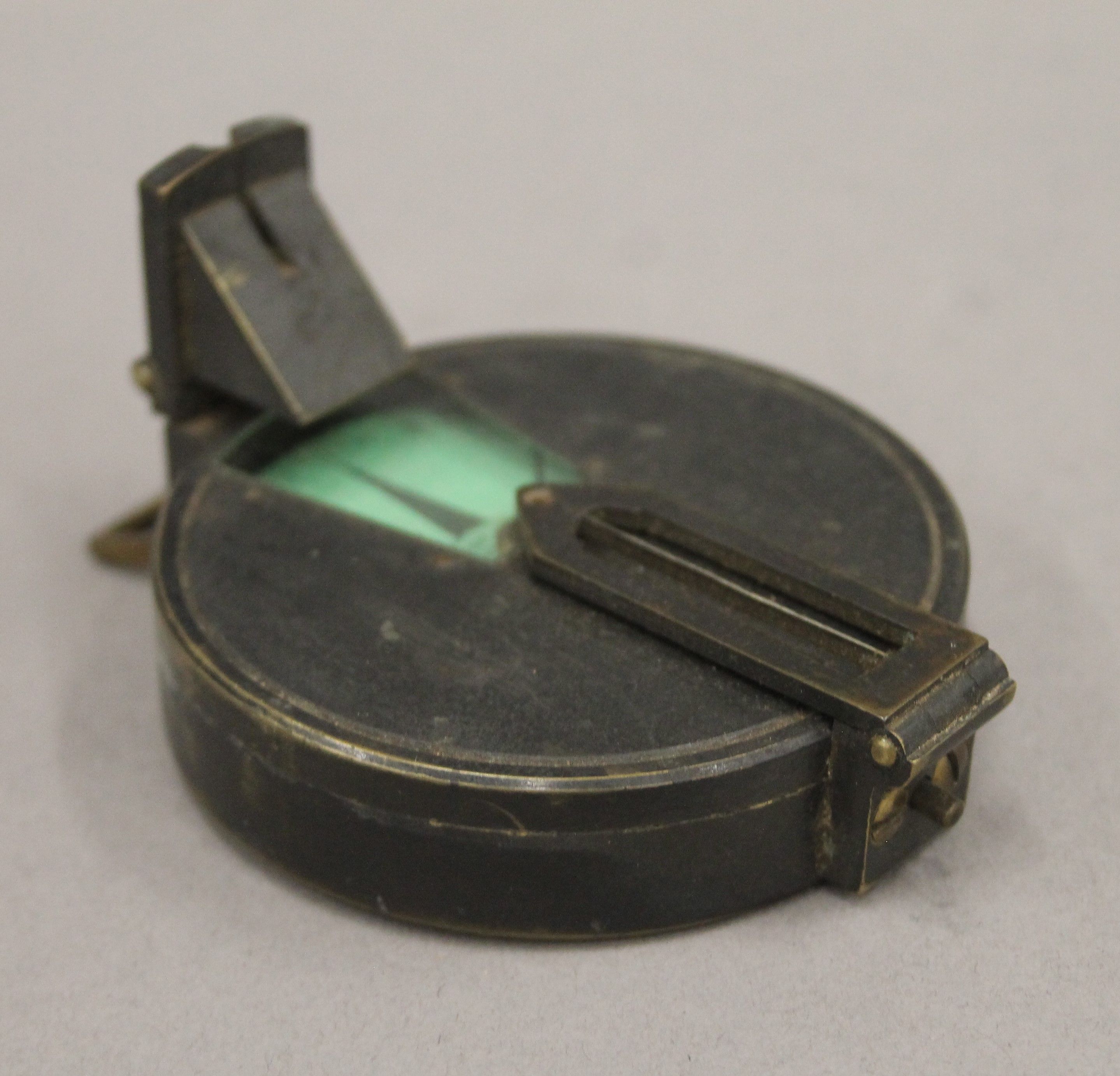 A leather cased military compass. 7 cm diameter. - Image 2 of 7