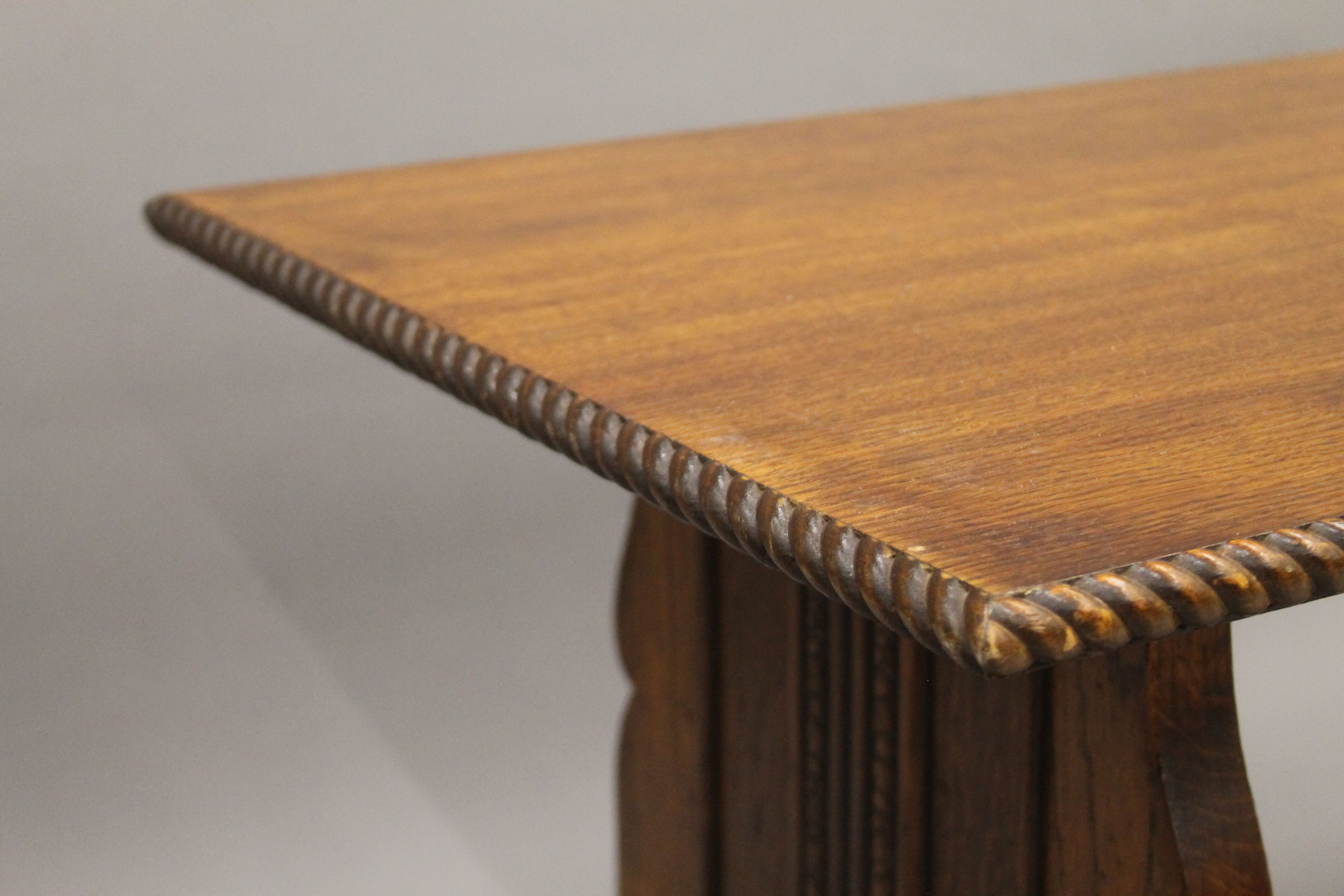 An early 20th century oak coffee table. 109 cm long. - Image 3 of 4