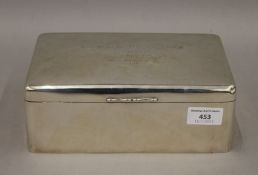 A large silver cigarette box, the lid inscribed 'Presented together with an Address to R.H.