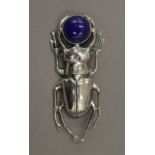 A silver brooch formed as a beetle. 5.5 cm long.