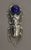 A silver brooch formed as a beetle. 5.5 cm long.