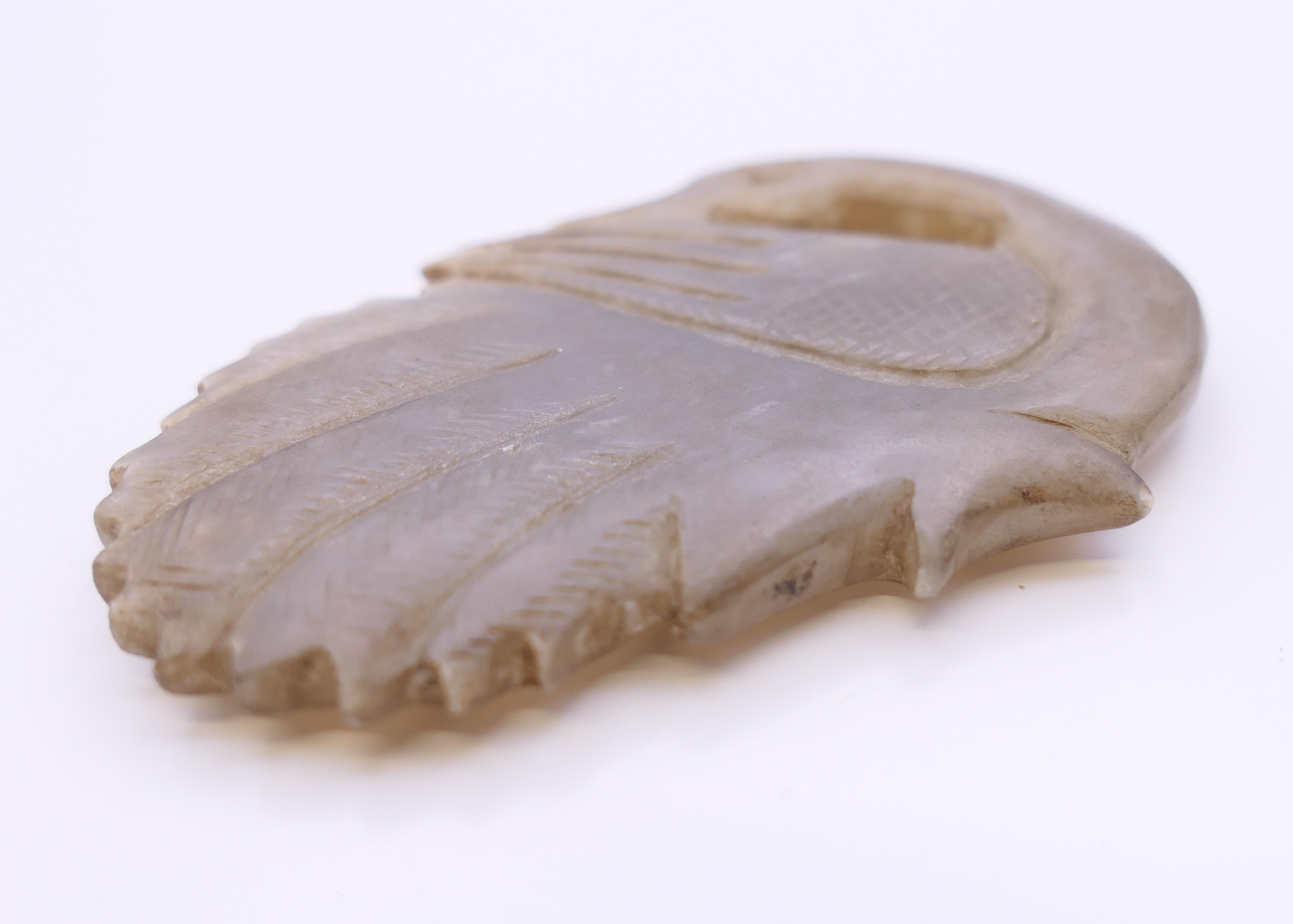 A Chinese light grey jade goose, Qing Dynasty. 5.5 cm long. - Image 3 of 5