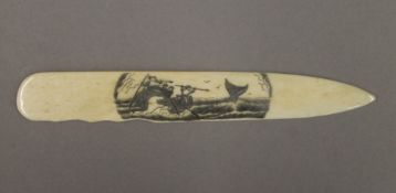 A scrimshaw page turner. 17 cm long.